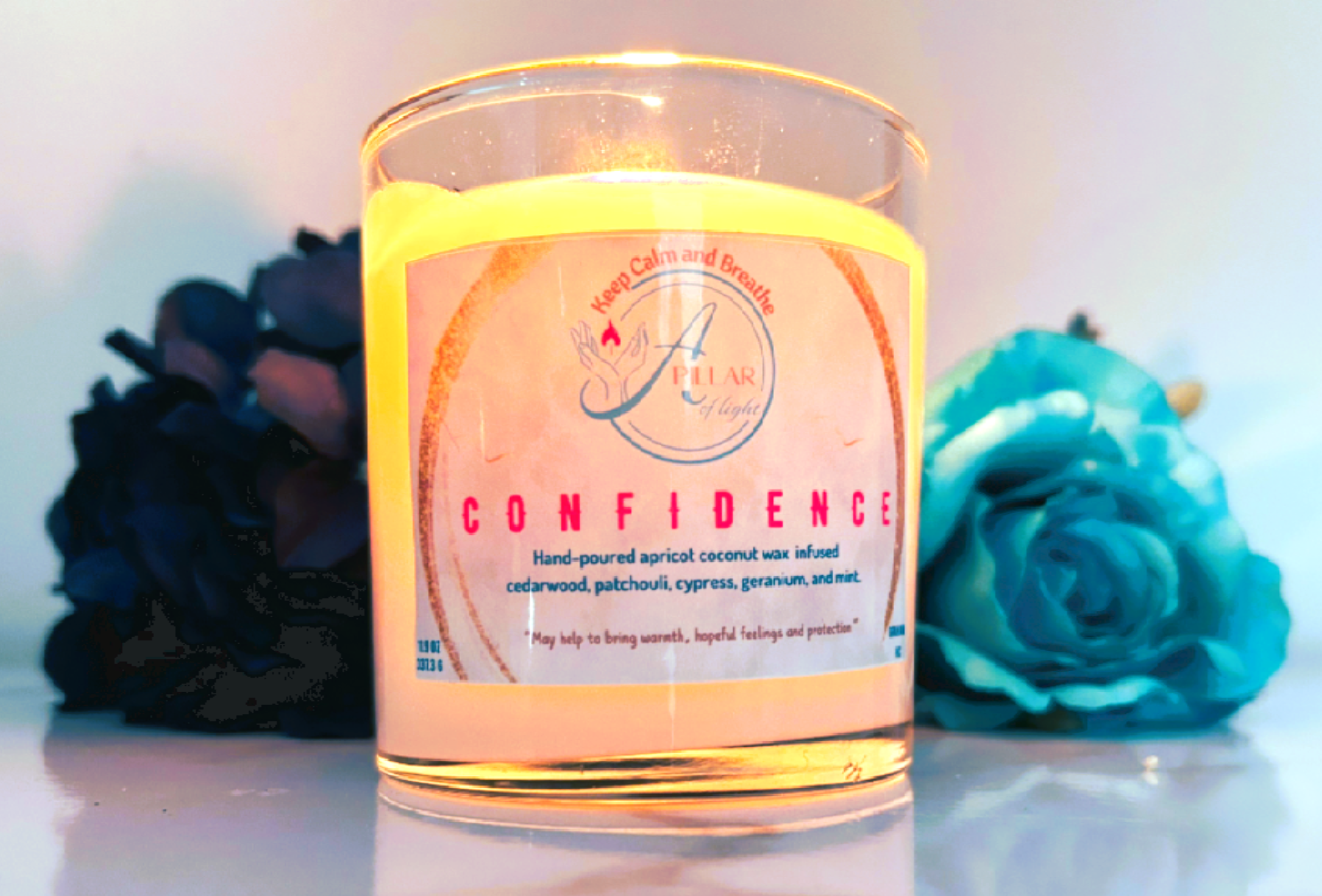 Premium 11.9 oz Confidence candle in elegant glass vessel with bronze-copper lid featuring woodsy aromatherapy blend