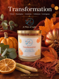 A jar candle labeled 'Transformation' by Apillar of Light, styled in an autumn scene with pumpkins, orange leaves, eucalyptus, cinnamon sticks, and a red knit blanket. The text at the top lists the scent notes: citrus, eucalyptus, artemisia, galbanum, and lemongrass.