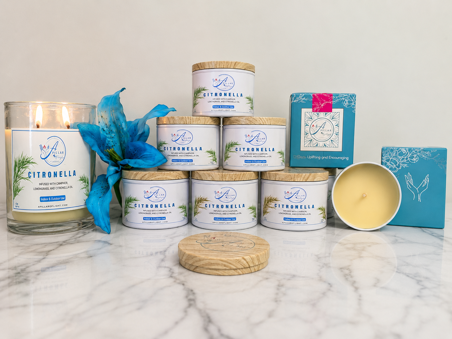 Shop A Pillar of Light’s Citronella Candle, infused with camphor, lemongrass, and citronella oil for indoor and outdoor use and a fresh, with lit candle on side