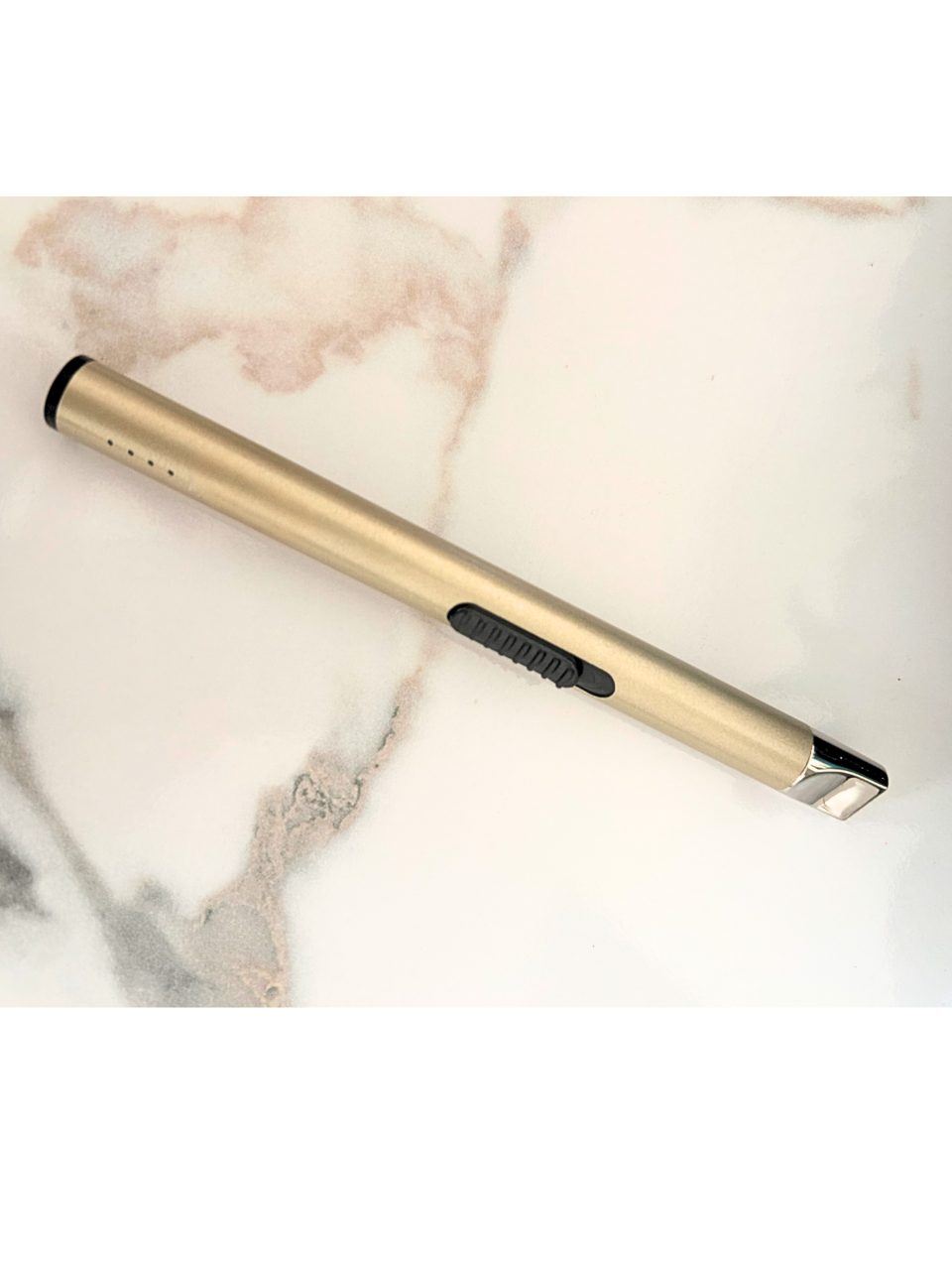 Gold USB with black accents on a marble surface