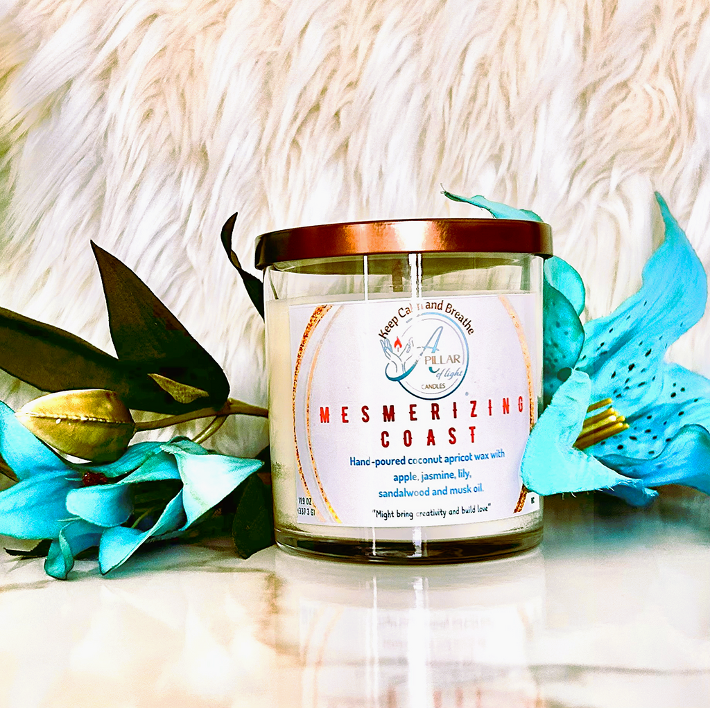 Hand-poured Mesmerizing Coast candle featuring crisp apple, jasmine and warm sandalwood for peaceful retreat atmosphere