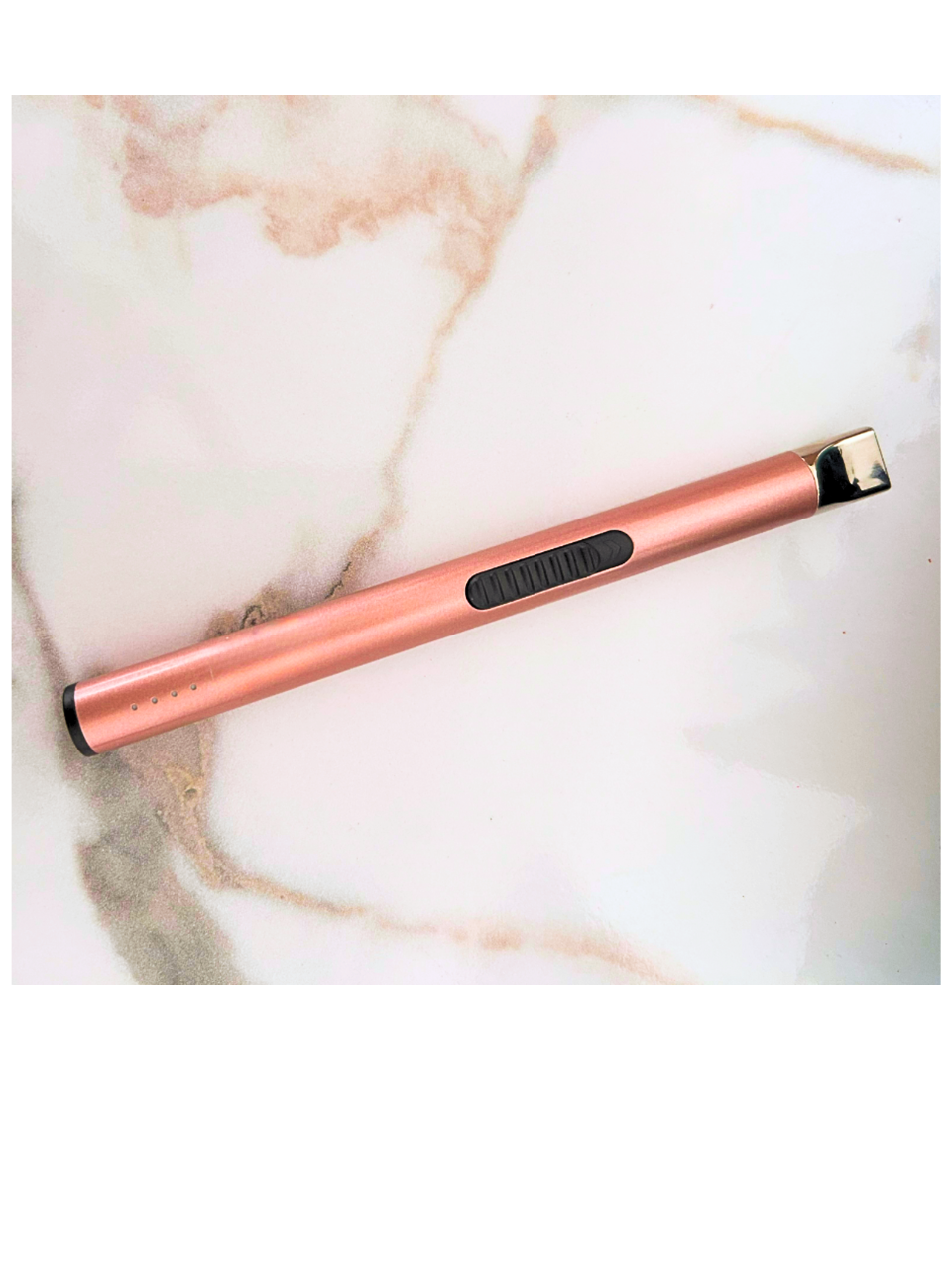 Rose gold lighter on a marble surface