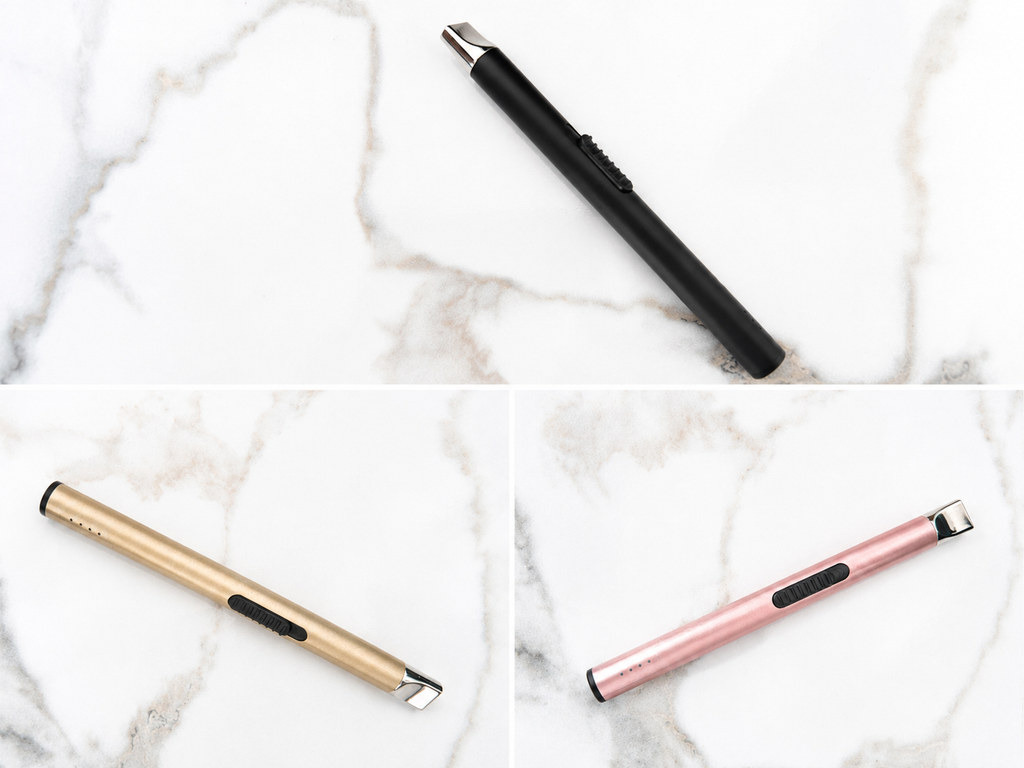 Three styluses in black, gold, and rose gold on a marble surface