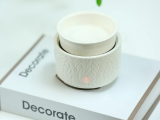 Small white container on a book with 'Decorate' text